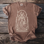 Brown t-shirt with a cream-colored graphic of a Viking woman with skulls and flowers below.