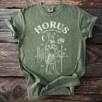 Green t-shirt with white line art of Egyptian falcon god Horus.