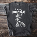 Dark t-shirt with white print of a lighthouse wrapped by kraken tentacles.