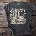T-shirt with illustration of a fox and raven amongst birch trees.