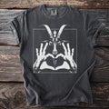 Dark t-shirt with white graphic of a goat head and hands forming a heart.
