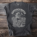 Dark t-shirt with white line art of a hippocampus and text "Hippocampus greek sea horse myth".
