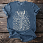 Blue t-shirt with a white intricate design of a moon goddess, birds, and thorny vines.