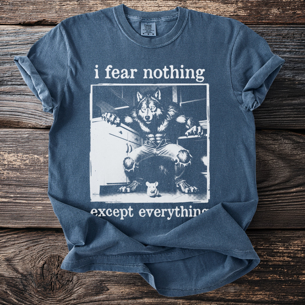 Blue t-shirt with "i fear nothing except everything" text and werewolf and mouse graphic.