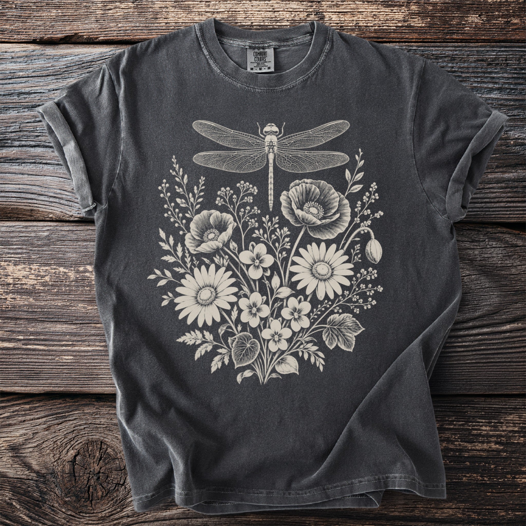 Dark grey t-shirt with a cream-colored dragonfly and floral graphic.