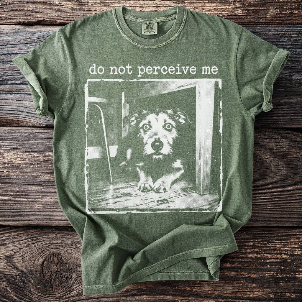 Green t-shirt with a distressed print of a dog and text "do not perceive me".