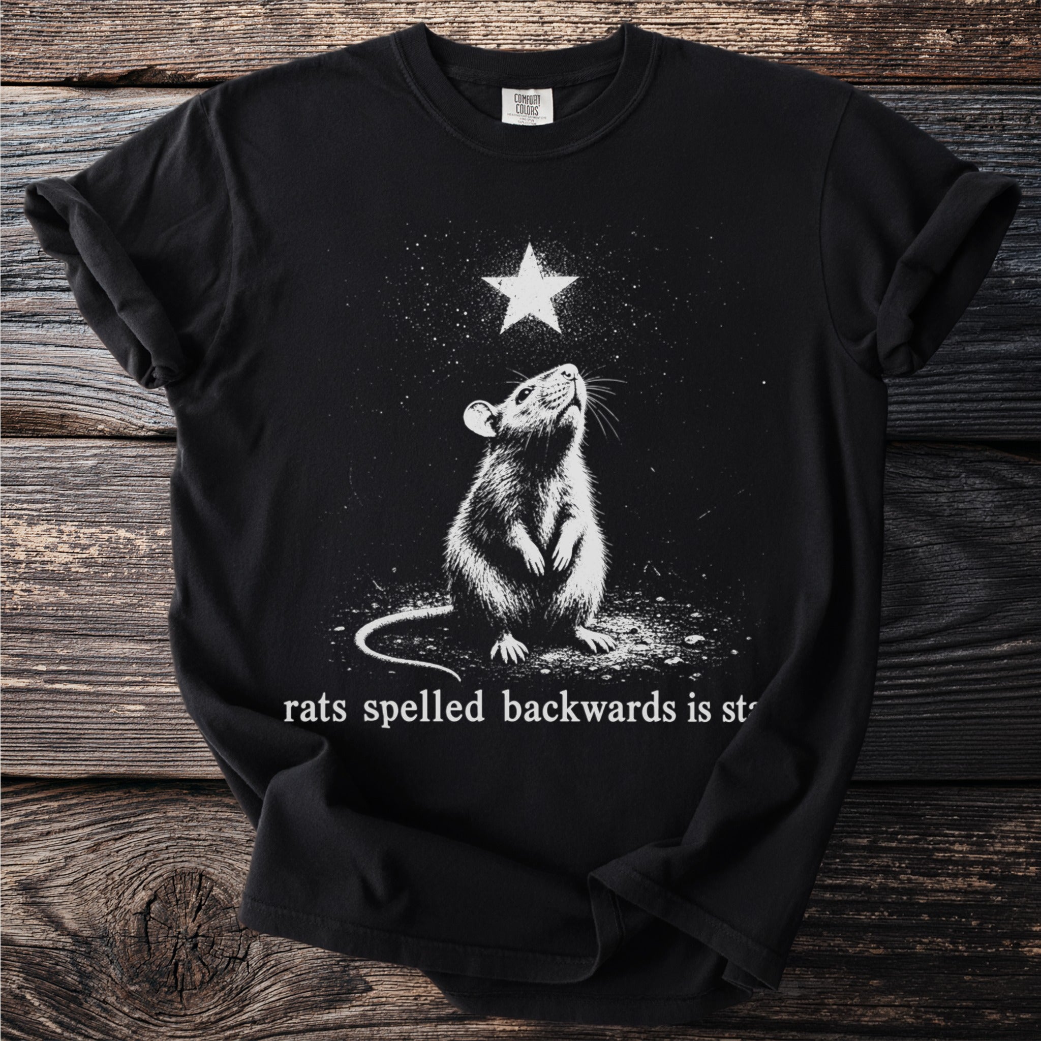 Black t-shirt with a rat looking up at a star and text reading "rats spelled backwards is star".