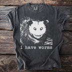 Charcoal gray t-shirt with a distressed possum graphic and text saying "i have worms."