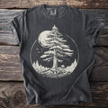 Dark t-shirt with a circular graphic of a pine tree, moon, mushrooms, and birds.