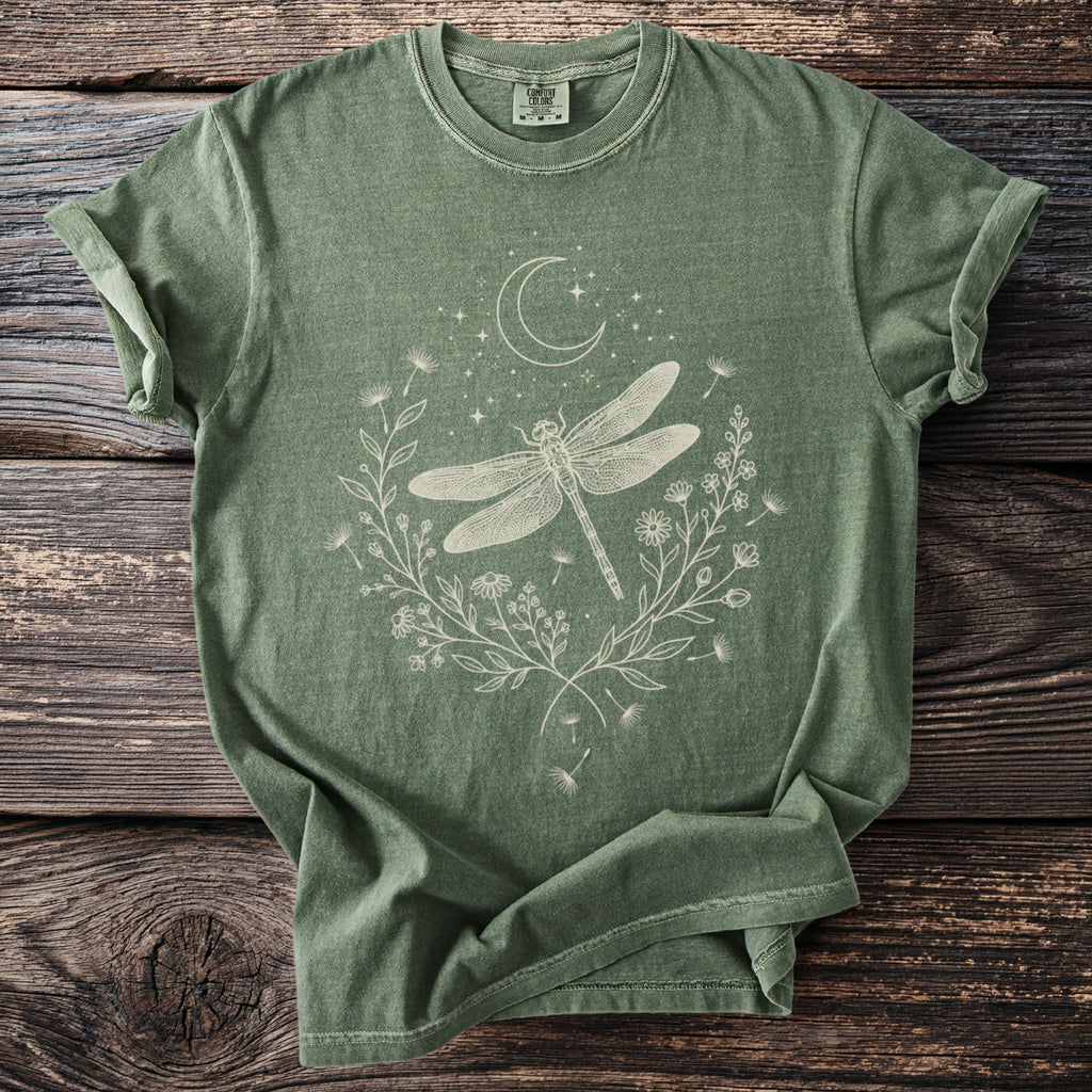 Green t-shirt with white dragonfly, moon, stars, and floral design.