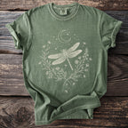 Green t-shirt with white dragonfly, moon, stars, and floral design.