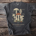 T-shirt with illustration of various mushrooms labeled "The Forager's Almanac Mycology Plate I."