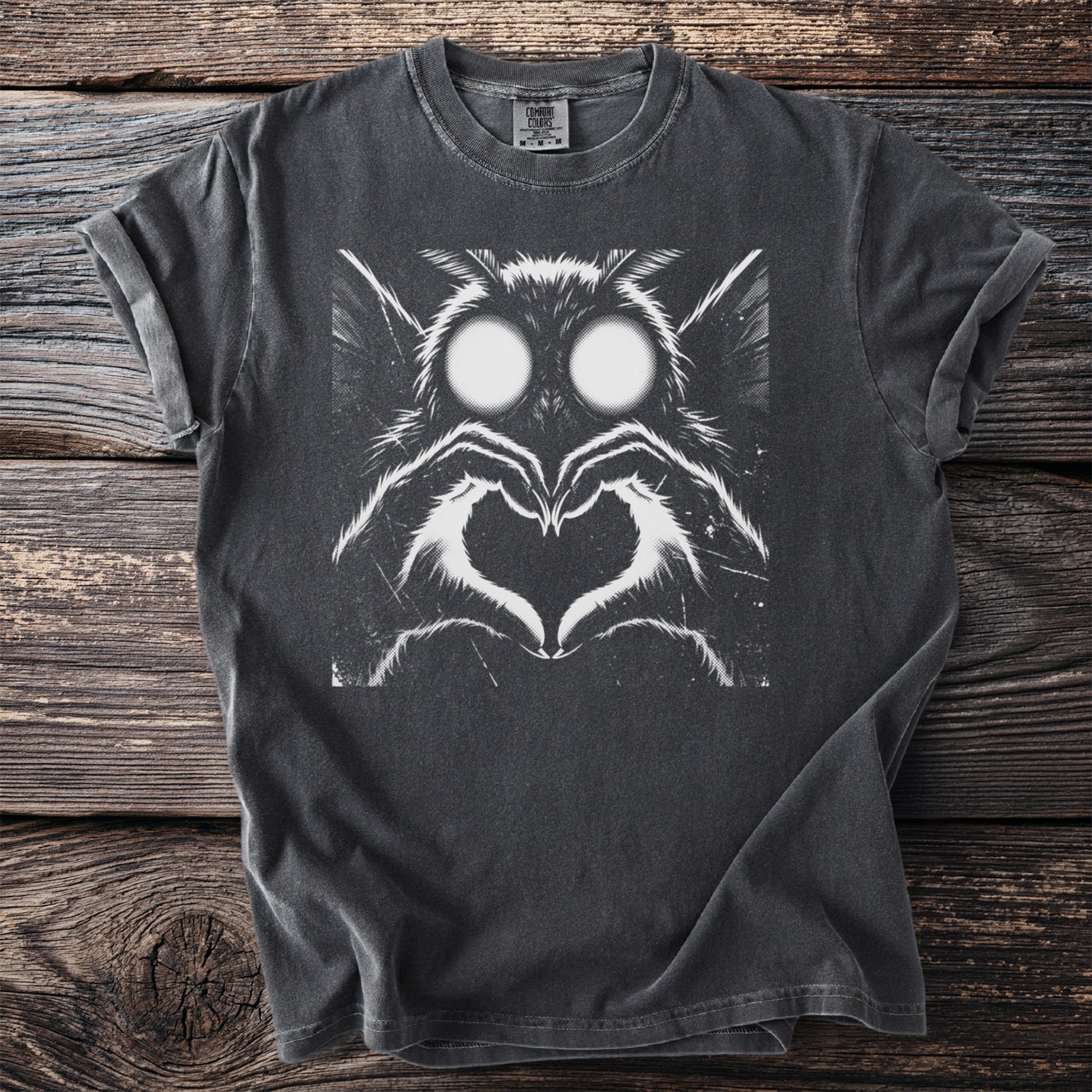 Dark grey t-shirt with white graphic of a moth making a heart shape.