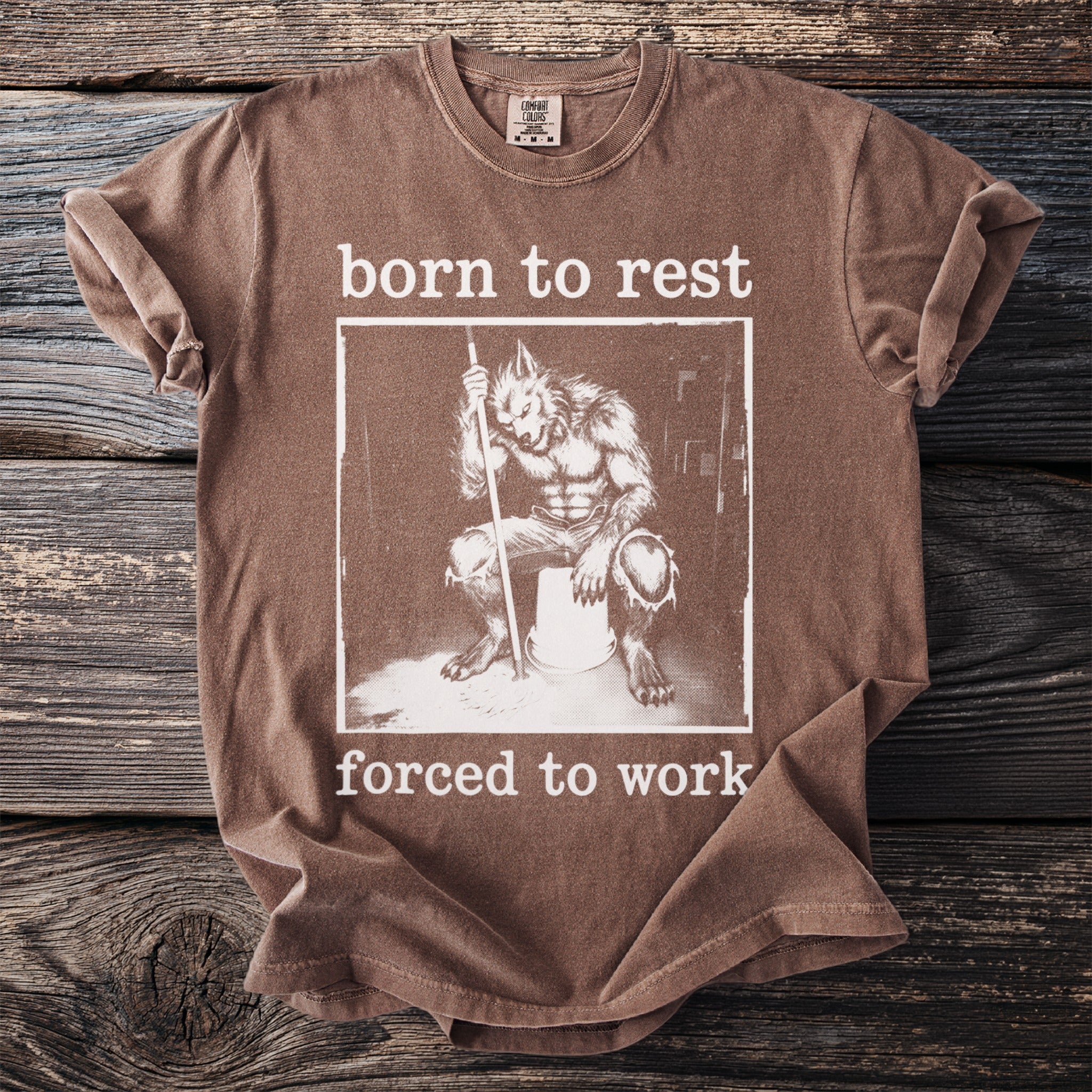 Brown t-shirt with "born to rest" and werewolf illustration, "forced to work" text.
