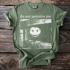 Olive green T shirt with a wide eyed bushbaby and “do not perceive me” text.