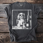 Black t-shirt with a vintage print of a dog wearing sunglasses with a champagne bottle and glass.
