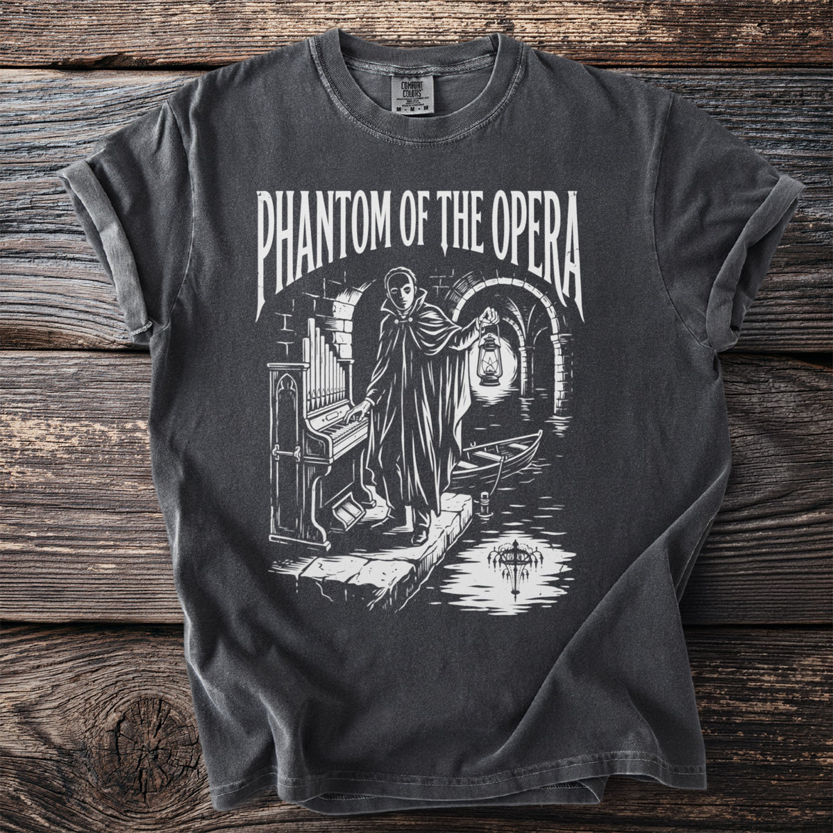 Phantom of the Opera t-shirt with graphic of character by organ and boat.