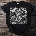 Black t-shirt with a white line art design of insects and plants, reading "respect the locals".