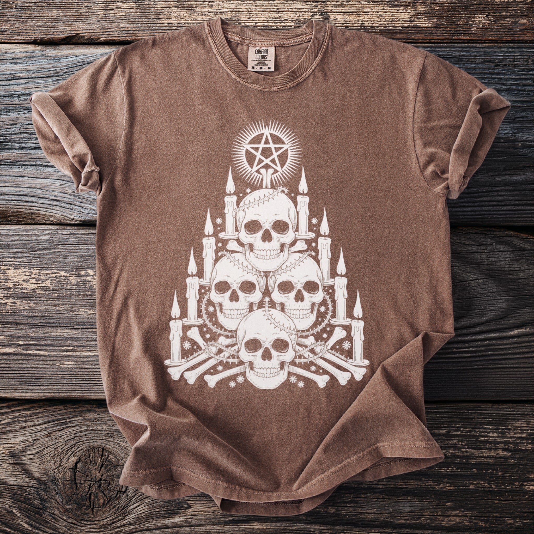 Brown t-shirt with white gothic skull, pentagram, candles, and bone graphic design.