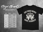 Black t-shirt with "God forbid women have hobbies" graphic and Comfort Colors 1717 size chart.