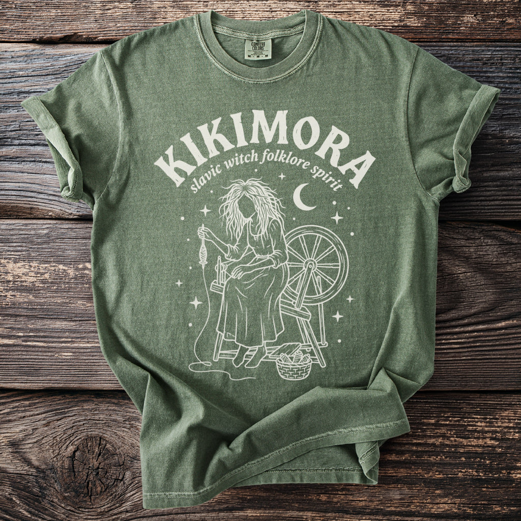 Green t-shirt with Kikimora slavic witch folklore spirit design.