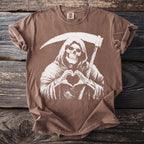 Brown t-shirt with grim reaper making heart shape with bony hands.