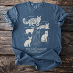 Blue t-shirt with illustrated cat breeds titled "The Cat Cabinet."