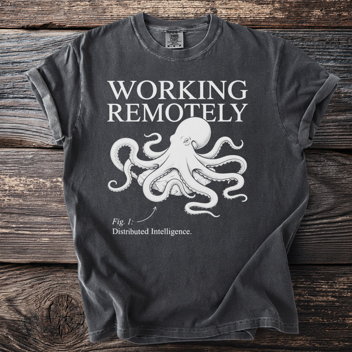 Dark t-shirt with "WORKING REMOTELY" text, an octopus graphic, and "Fig. 1: Distributed Intelligence."