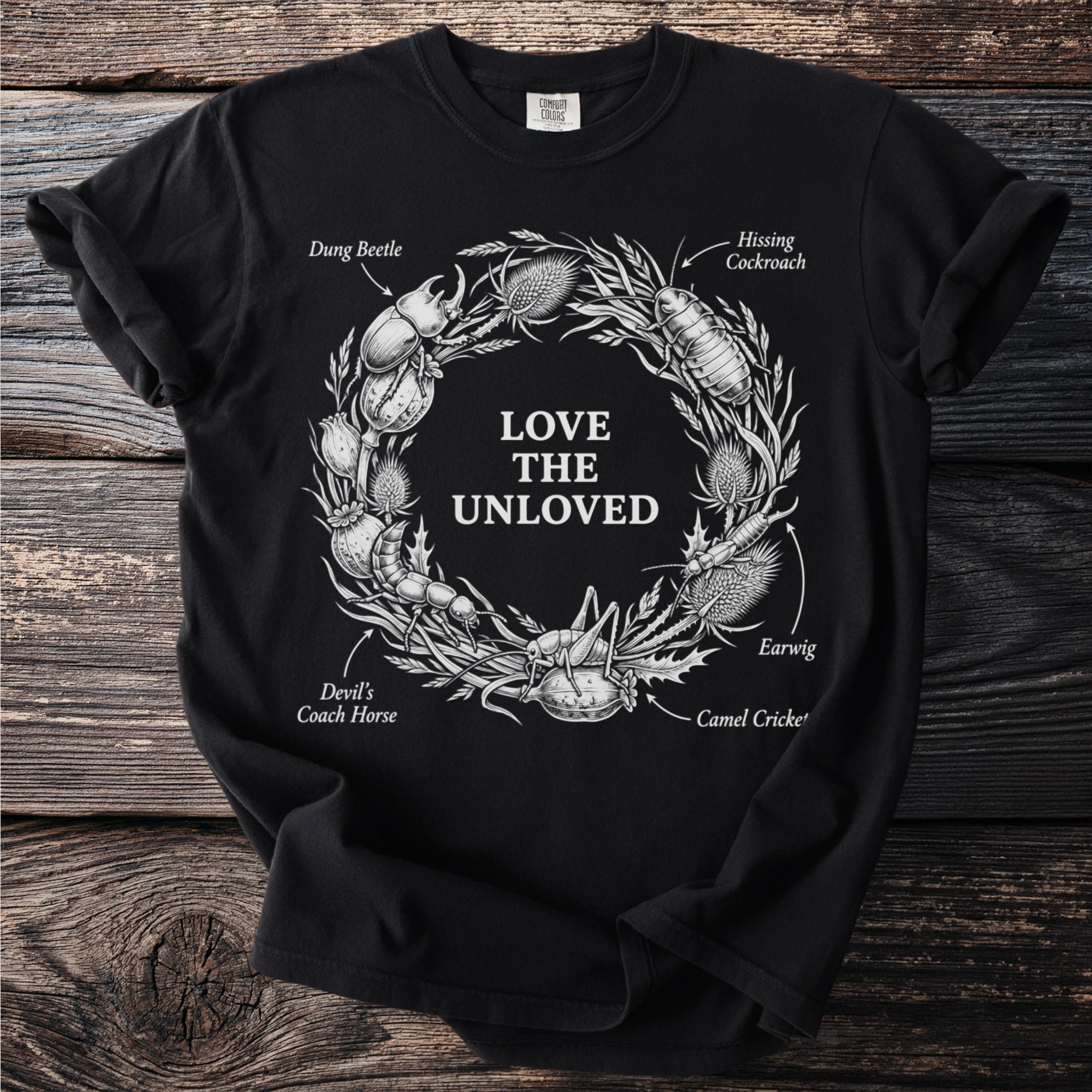 Black t-shirt with graphic of insects forming a wreath and text "Love the Unloved".