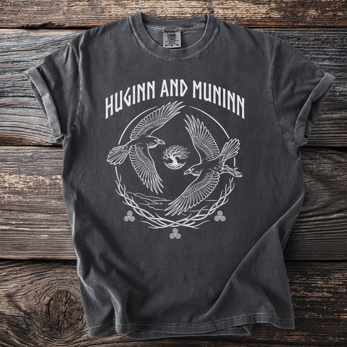 Dark t-shirt with white graphic of Huginn and Muninn ravens, Yggdrasil, and knotwork.