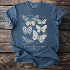 Blue t-shirt with vintage butterfly illustrations and "The Psyche Cabinet" text.