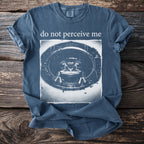 Dark blue t-shirt with white text "do not perceive me" above a frog image.