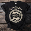 Black t-shirt with cream Wayfinder text and circular graphic of rabbits and moon phases.