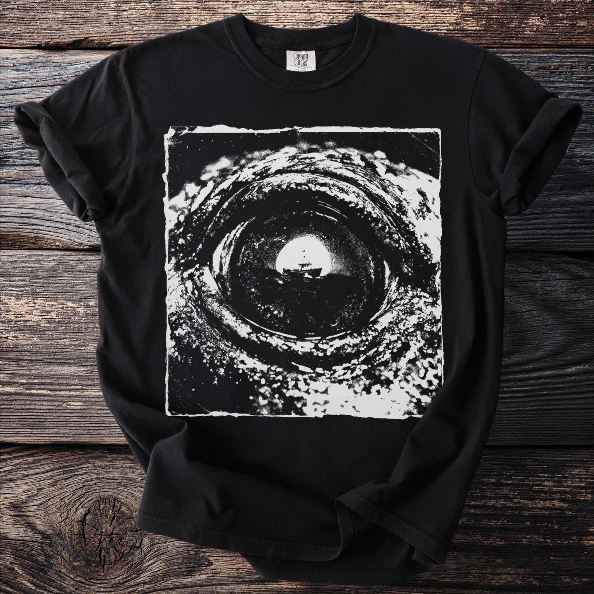 Black t-shirt with a distressed graphic of a boat seen through a tunnel.