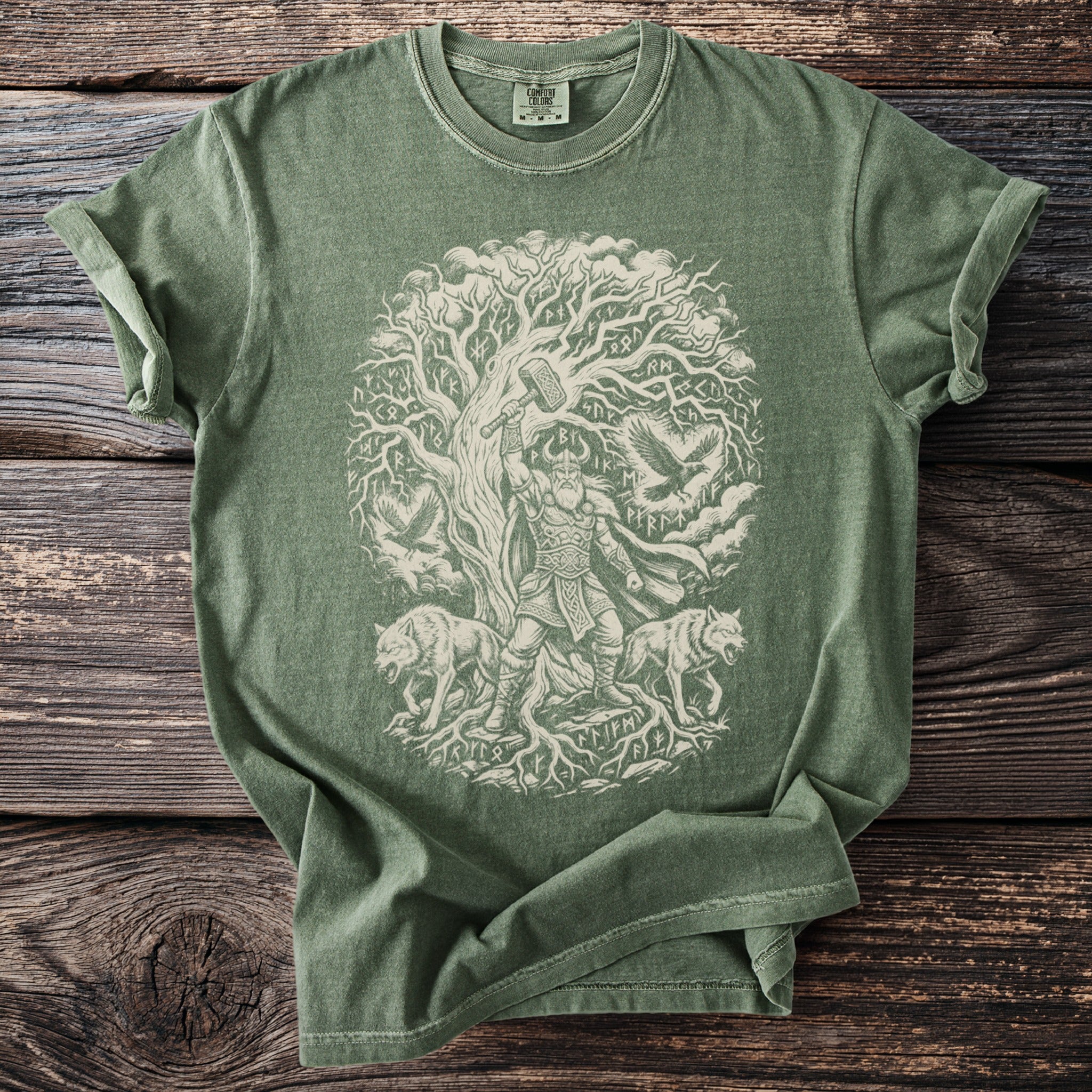Green t-shirt with a circular Viking-themed graphic featuring Thor, wolves, and runes.