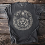 Dark grey t-shirt with white graphic of fairies dancing around mushrooms under a full moon.