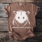 Brown comfort colors t-shirt with white possum graphic and text.