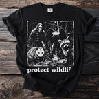 Black t-shirt with Bigfoot, bat, opossum, raccoon, and frog graphic with text "protect wildlif".