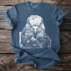Indigo t-shirt with white graphic of an intense pigeon's face and Comfort Colors tag.