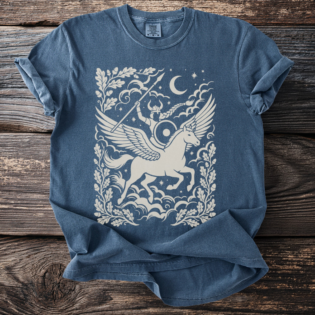 Blue t-shirt with a cream graphic of a winged unicorn and a Viking rider.