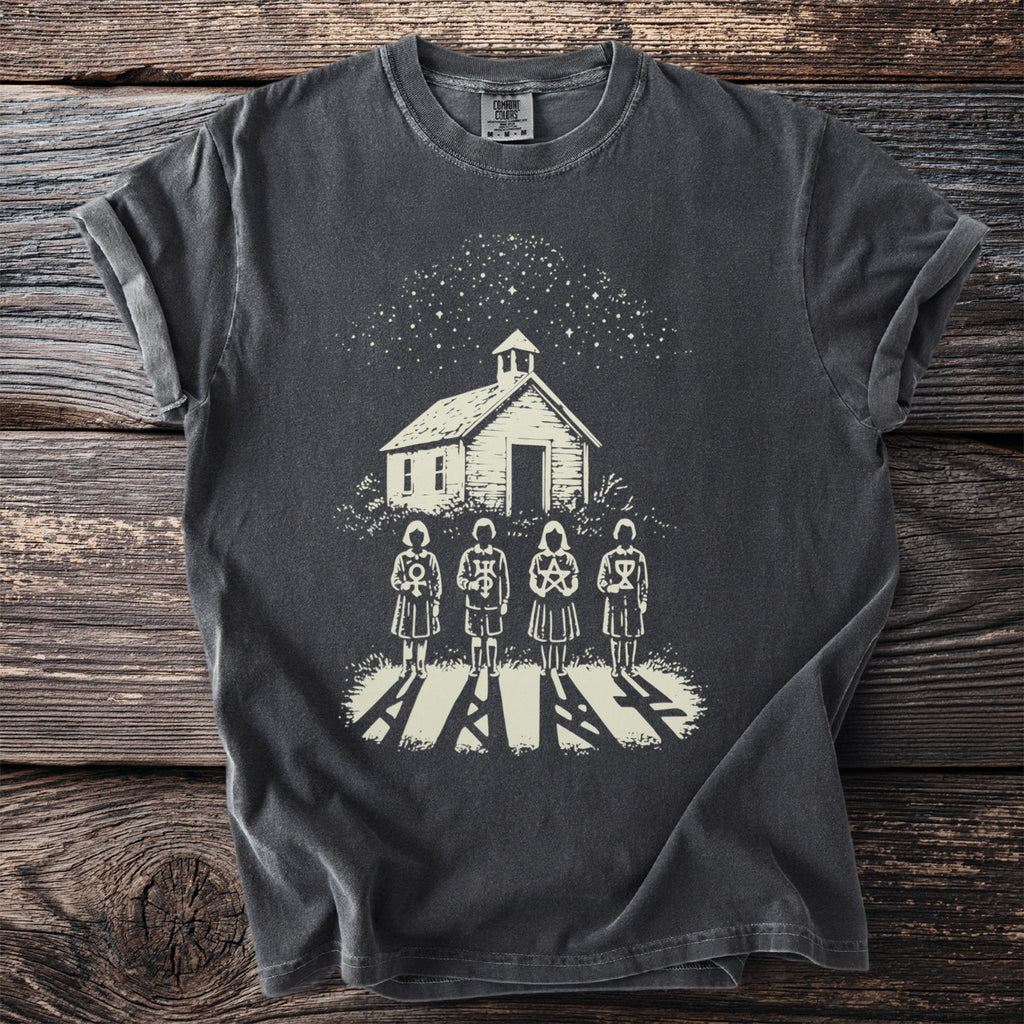 Four figures stand before a schoolhouse under a starry sky.