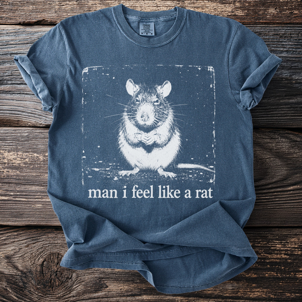Blue t-shirt with a white graphic of a rat and the text "man i feel like a rat".
