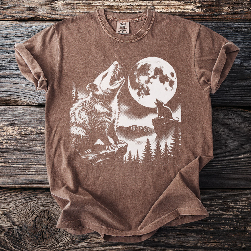 Brown t-shirt with a graphic of two possums howling at the moon.