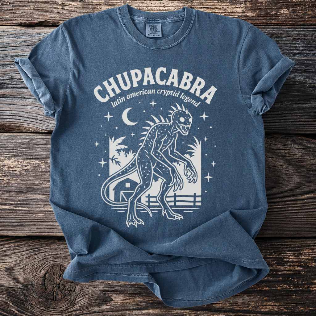 Chupacabra latin american cryptid legend t-shirt with creature and rural nighttime scene.