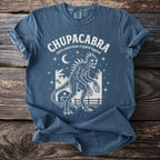 Chupacabra latin american cryptid legend t-shirt with creature and rural nighttime scene.