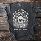 Dark t-shirt with a skull and botanical design, saying "ALL PLANTS ARE EDIBLE SOME ONLY ONCE".