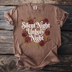 Brown t-shirt with "Silent Night Unholy Night" text and rose bouquet design.