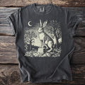 Dark grey t-shirt with a vintage style graphic of a hare on a tombstone under a crescent moon.