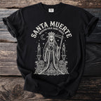 Black t-shirt with Santa Muerte folk outline graphic and text.