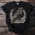 Black t-shirt with a cream raven and oak wreath graphic.